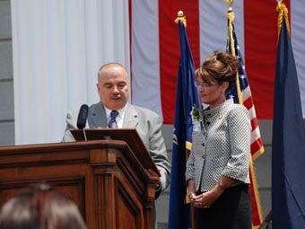 man and woman at a podium