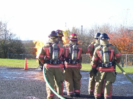 firemen with a hose