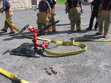 firemen with a hose