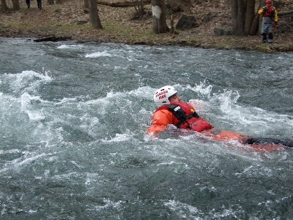 person floating in choppy water